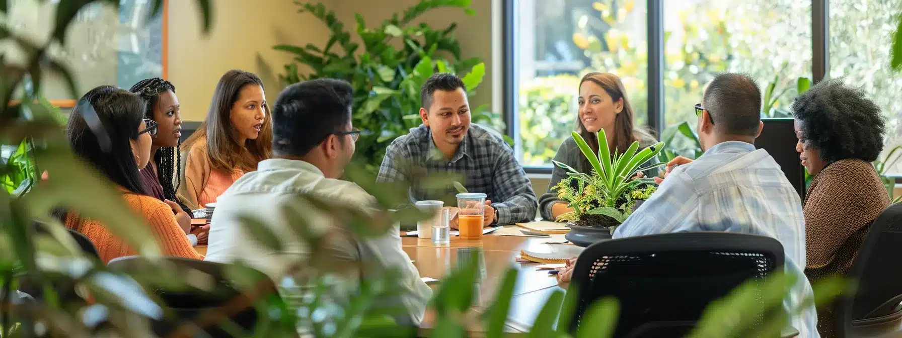 a group of diverse employees gathered around a conference table, engaged in a meaningful discussion about ethical business practices.