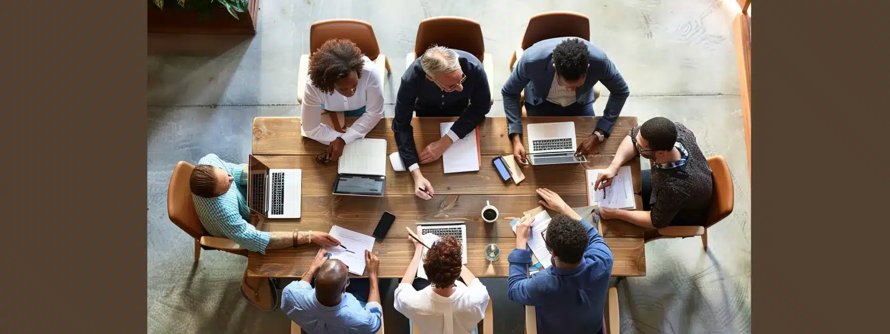 a diverse group of consultants brainstorming around a collaborative table, with innovative ideas visibly sparking in the air.