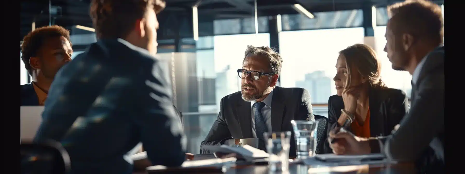 a group of diverse professionals inside a modern office, discussing a business challenge with thoughtful expressions and a bible on the desk.